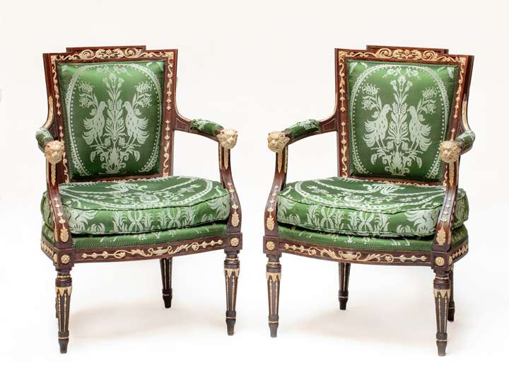 The Viceroy of Savoy Neoclassical armchairs.A pair of Italian  carved  walnut and pastiglia cream and brown painted armchairs